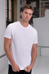 Male Model wearing GOEX Unisex and Men's Standard Cotton Tee in White
