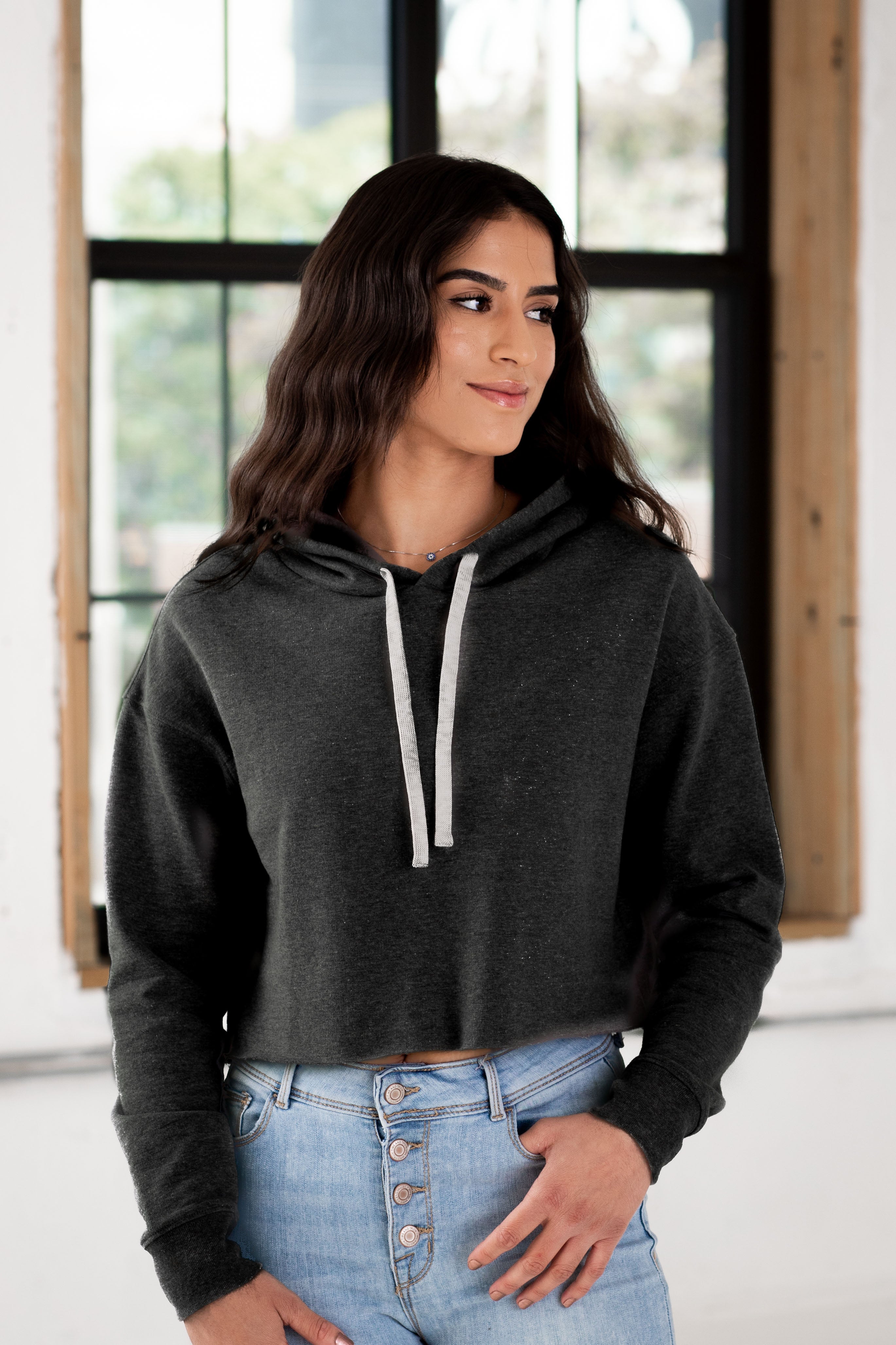 Female Model wearing GOEX Ladies Fleece Crop Hoodie in Charcoal