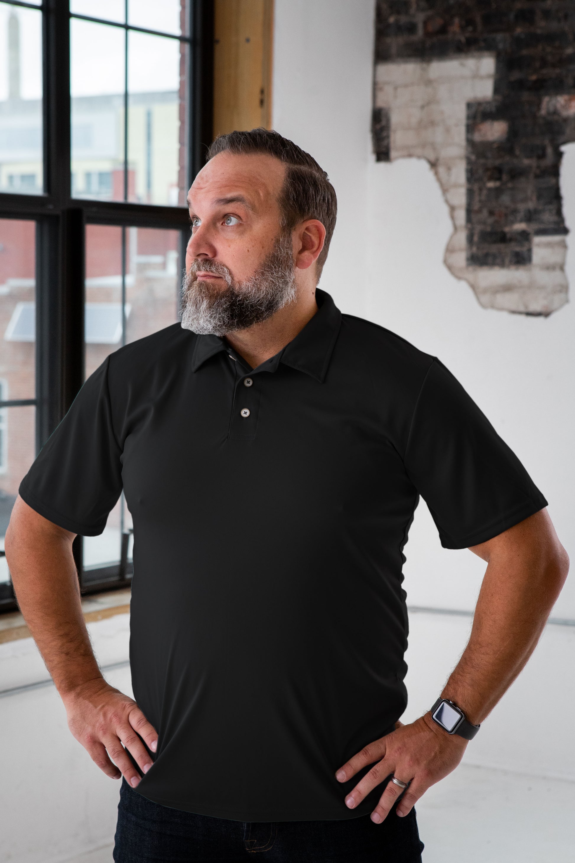 Male Model wearing GOEX Unisex and Men's Eco Poly Polo in Black