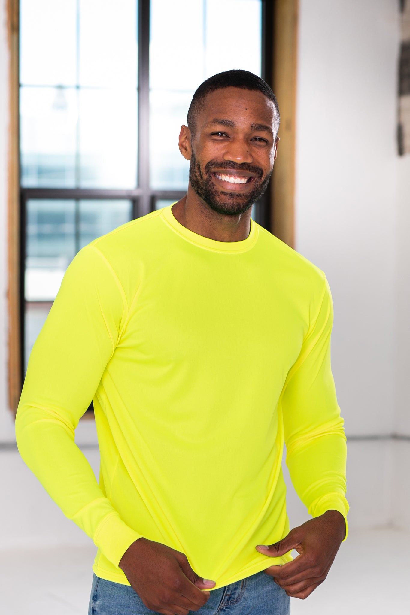 Male Model wearing GOEX Unisex and Men's Eco Poly LS Tee in Safety Yellow