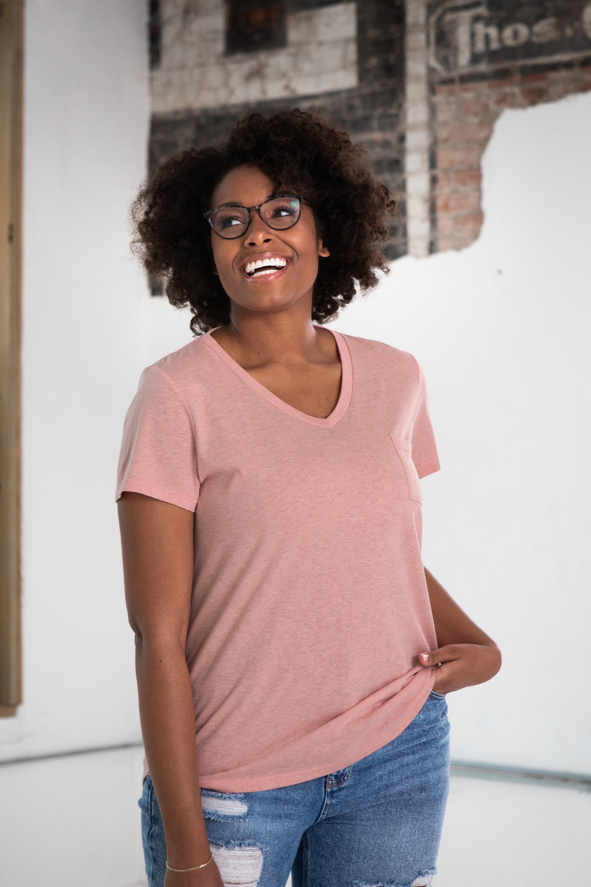 Female Model wearing GOEX Ladies Eco Triblend Drop Hem Pocket Tee in Rose