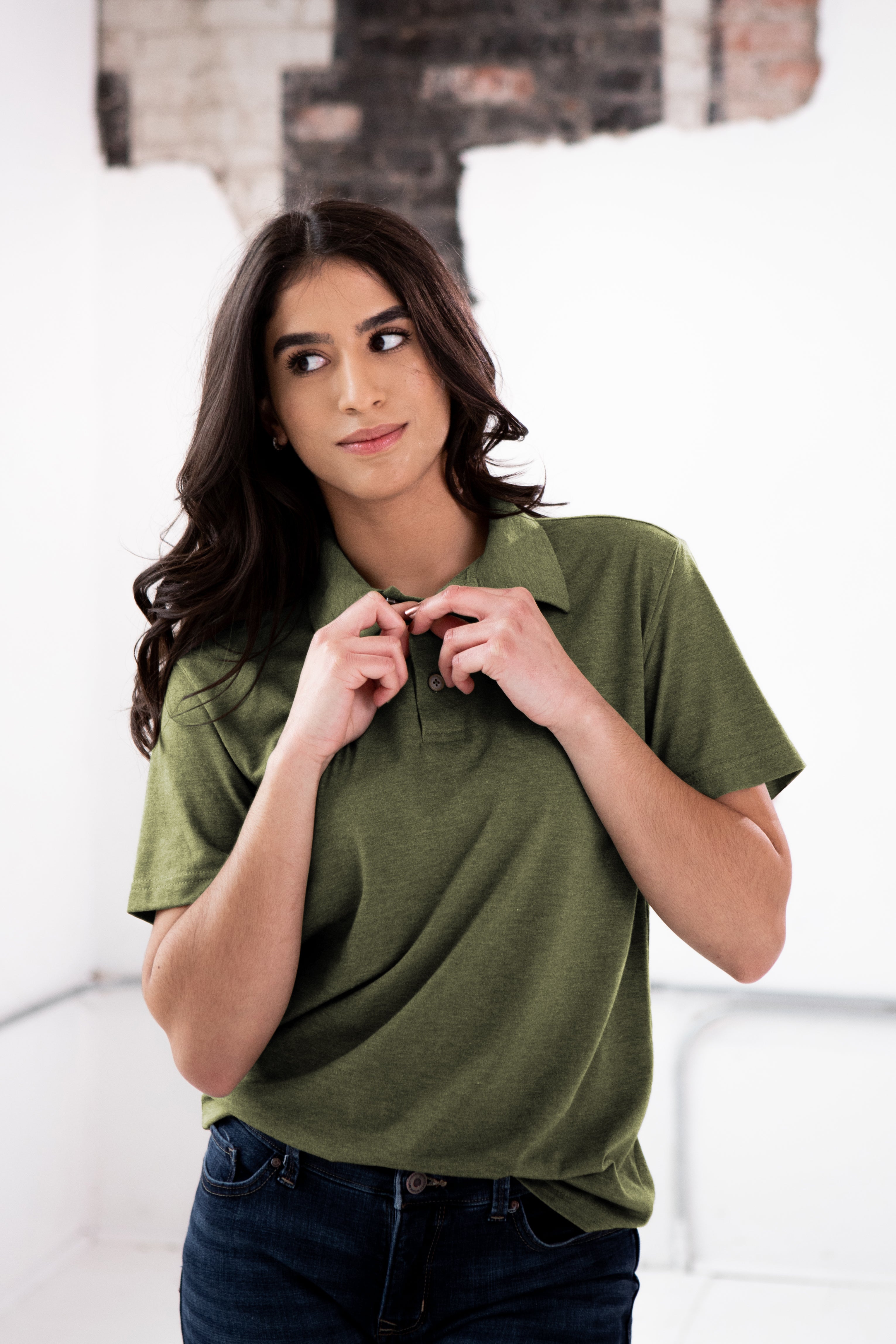 Female Model wearing GOEX Unisex and Men's Eco Triblend Polo in Olive