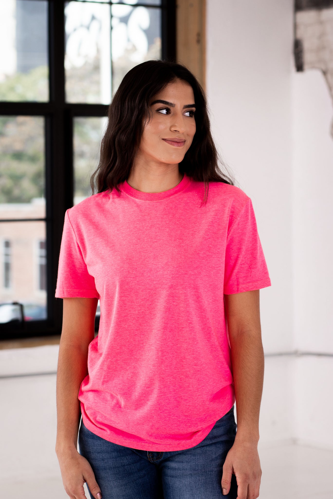 Female Model wearing GOEX Eco Triblend Unisex and Men's Tee in Neon Pink
