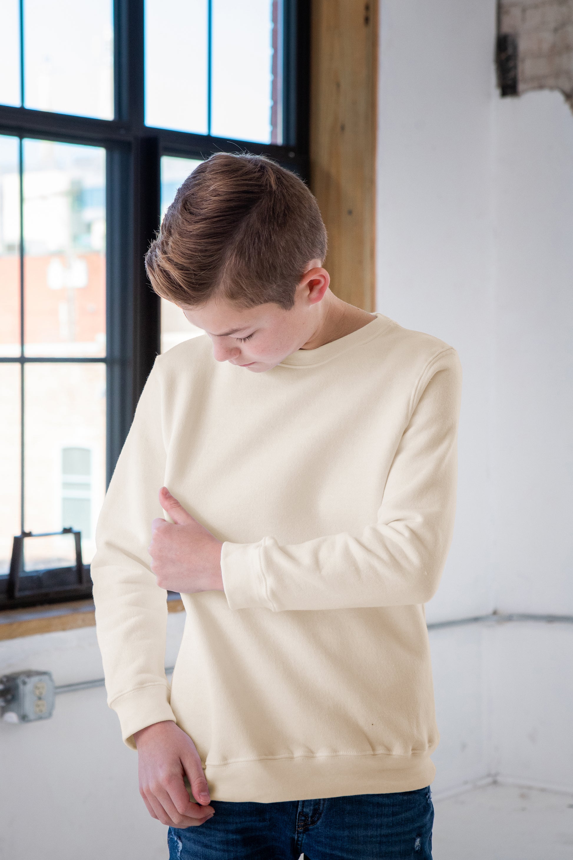 Boy Model wearing GOEX Youth Fleece Crew in Ivory