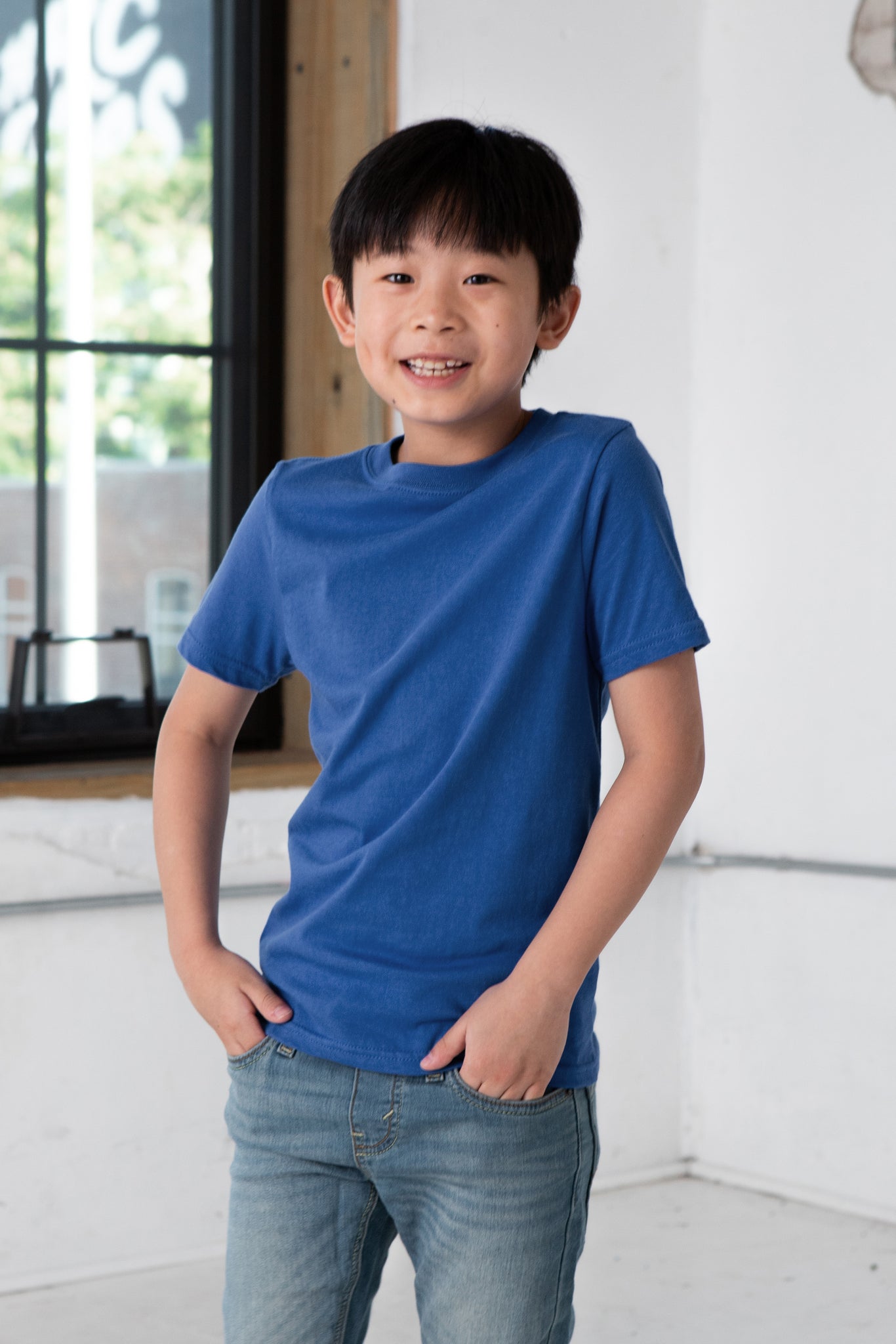 Boy Model wearing GOEX Youth Premium Cotton Tee in Royal
