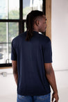 Back View of Male Model wearing GOEX Unisex and Men's Eco Poly Tee in Navy