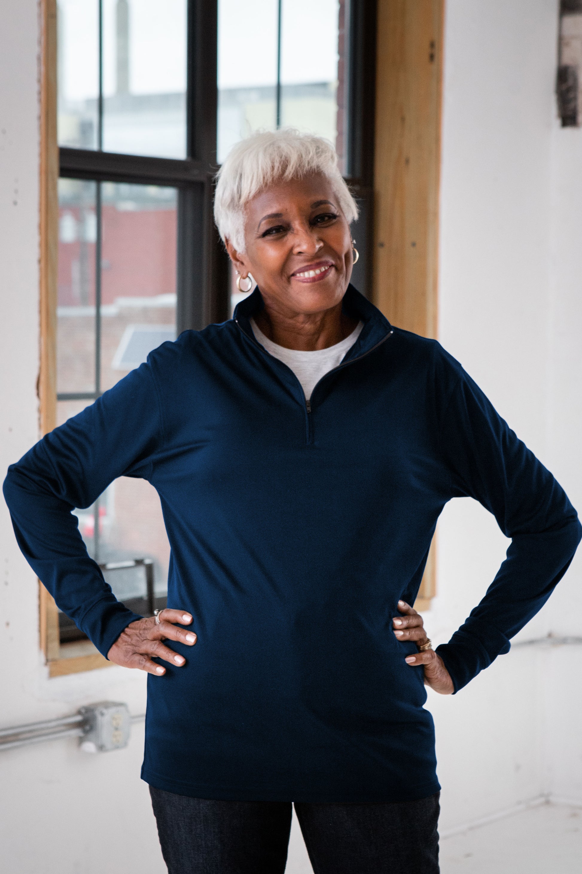 Female Model wearing GOEX Unisex and Men's Eco Poly 1/4 Zip in Navy