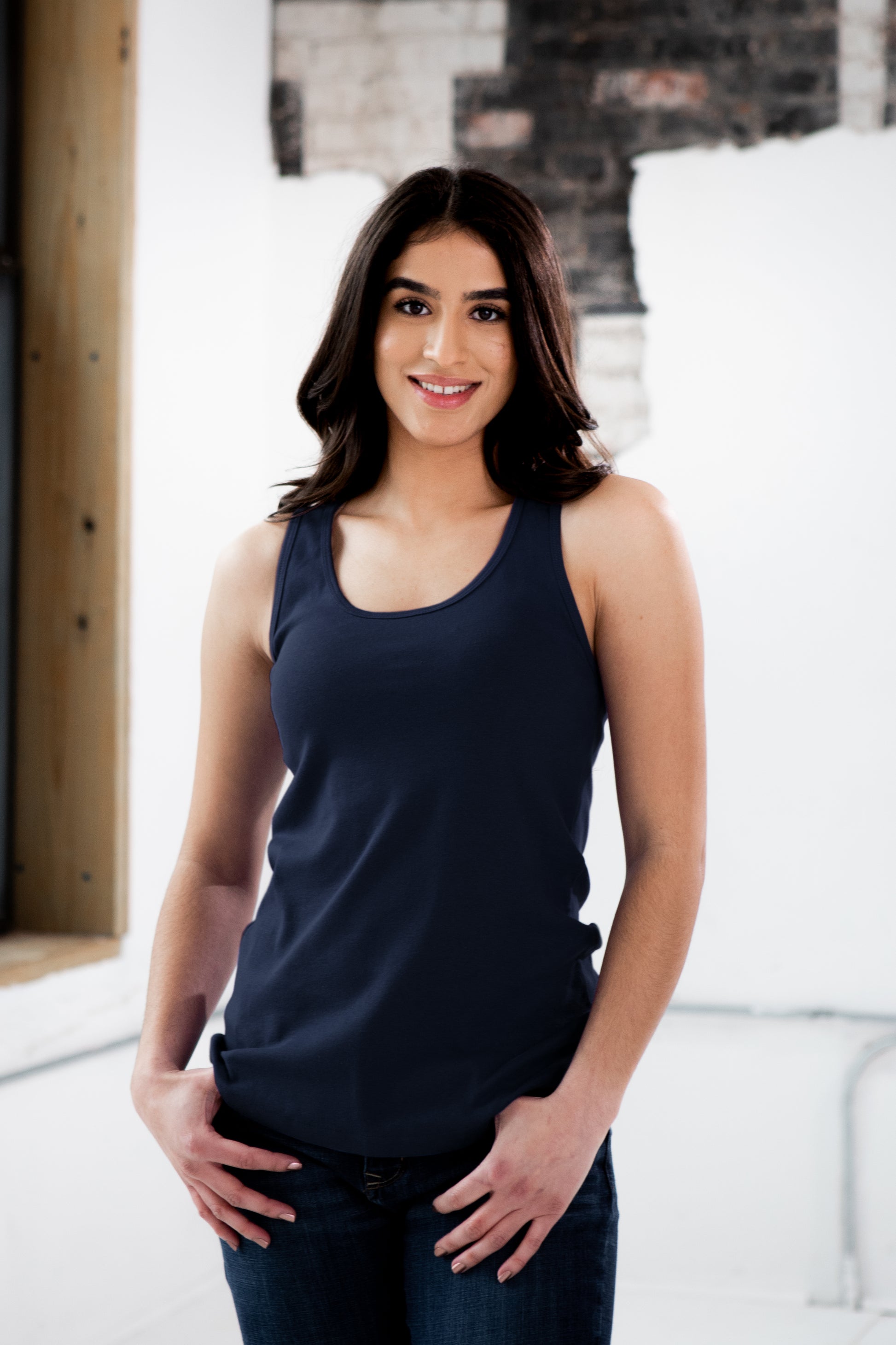 Female Model wearing GOEX Ladies Cotton Rib Tank in Navy