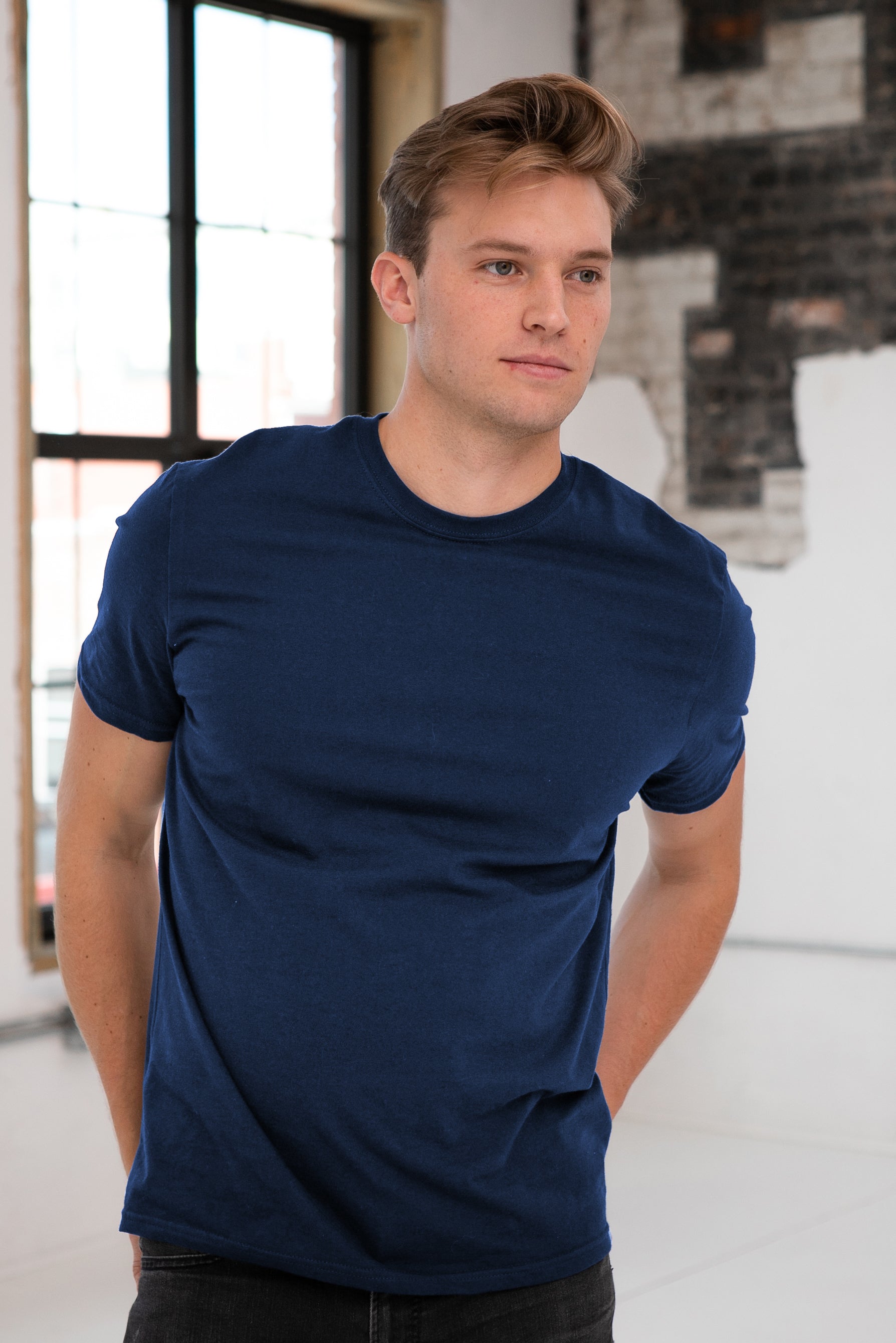 Male Model wearing GOEX Unisex and Men's Premium Cotton Tee in Navy