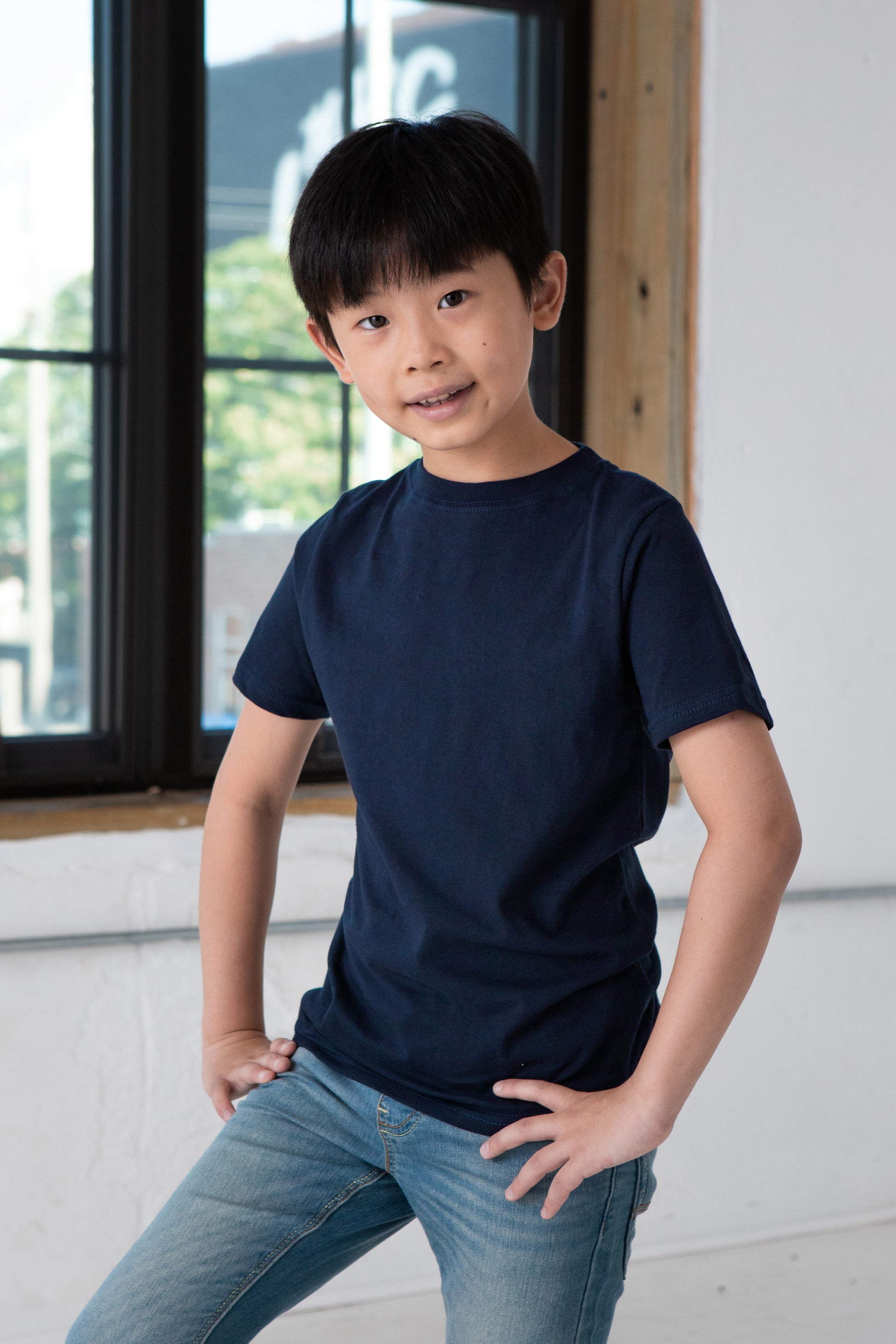 Boy Model wearing GOEX Youth Premium Cotton Tee in Navy