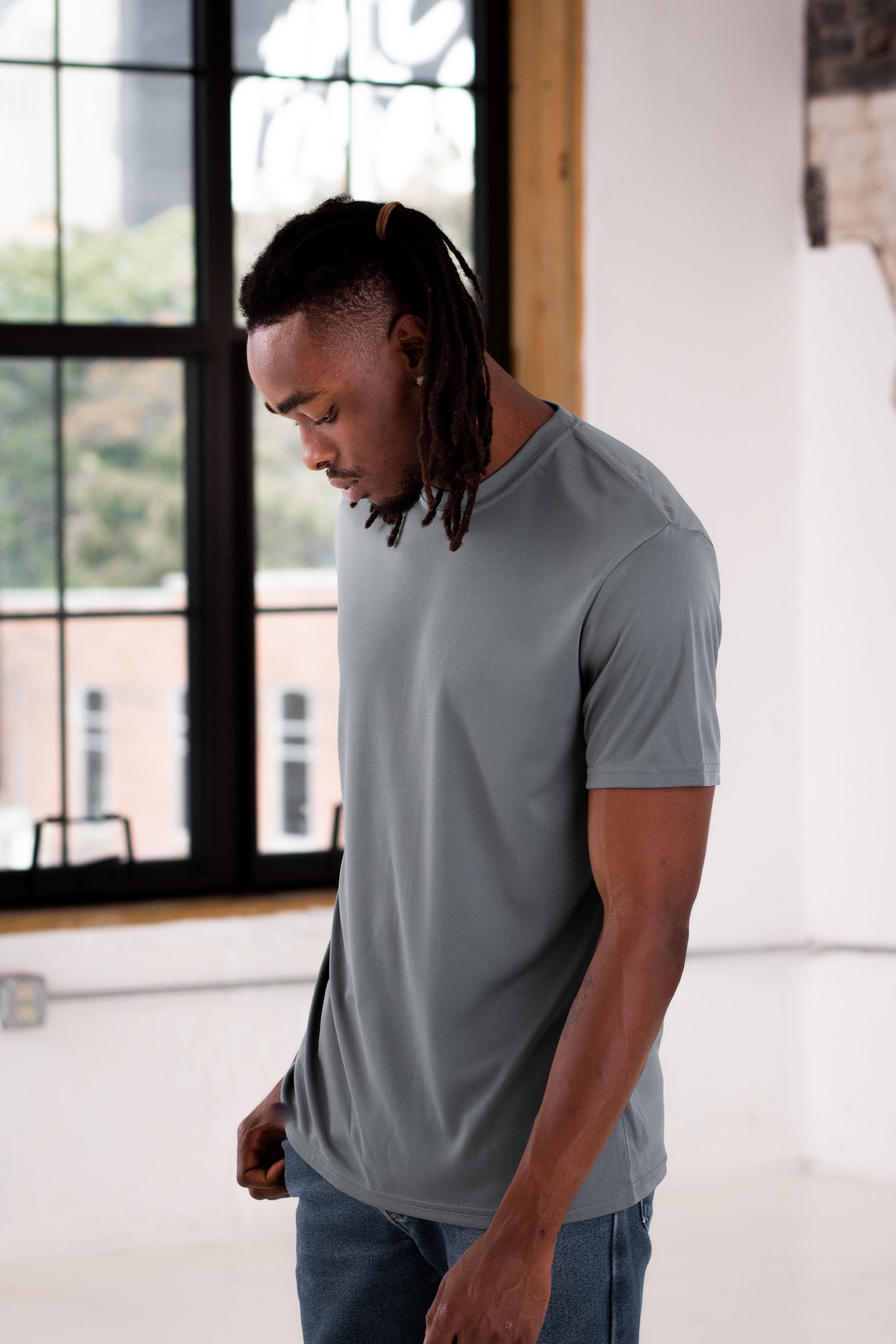 Male Model wearing GOEX Unisex and Men's Eco Poly Tee in Grey