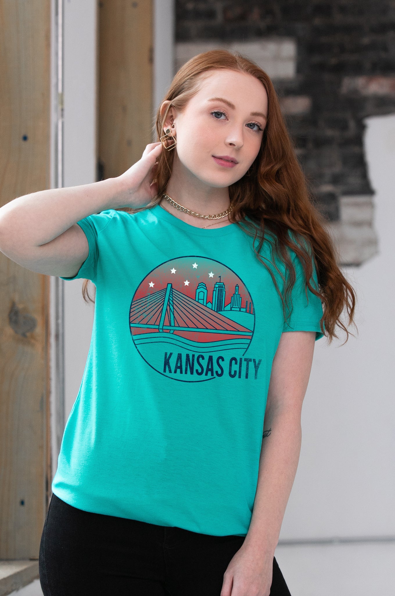 Female Model wearing GOEX Ladies KC Riverfront Eco Triblend Graphic Tee in Teal
