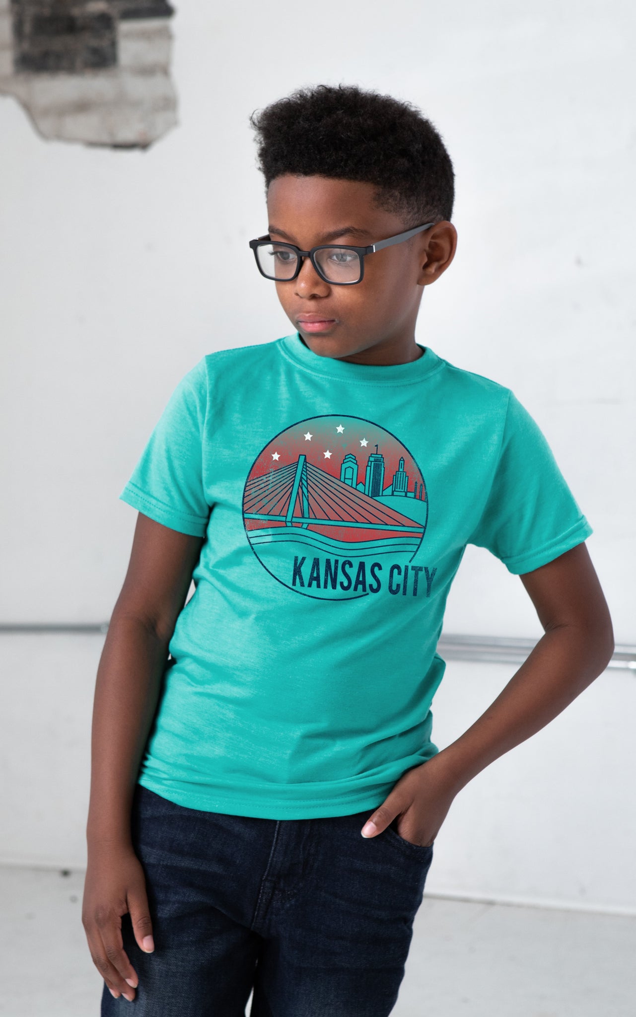 Boy Model wearing GOEX Youth KC Riverfront Eco Triblend Graphic Tee in Teal