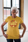 Female Model wearing GOEX Ladies Choose Kindness Eco Triblend Graphic Tee in Mustard
