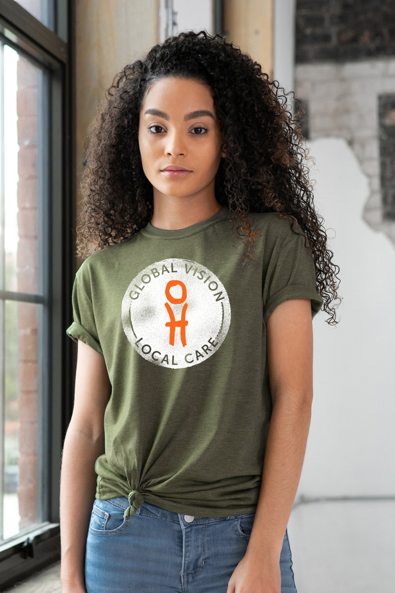 Female Model wearing GO Project Graphic Tee in Olive