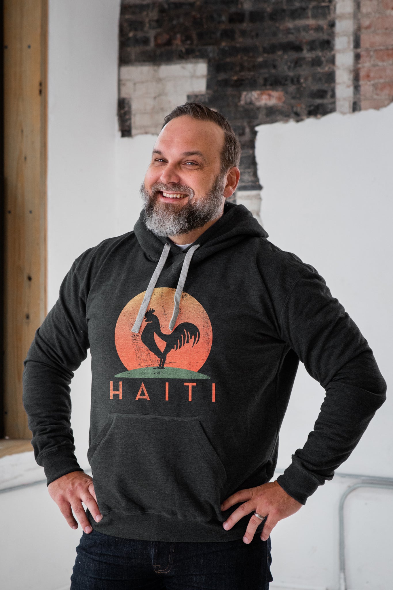Male Model wearing GOEX Haiti Rooster Graphic on Charcoal Fleece Hoodie