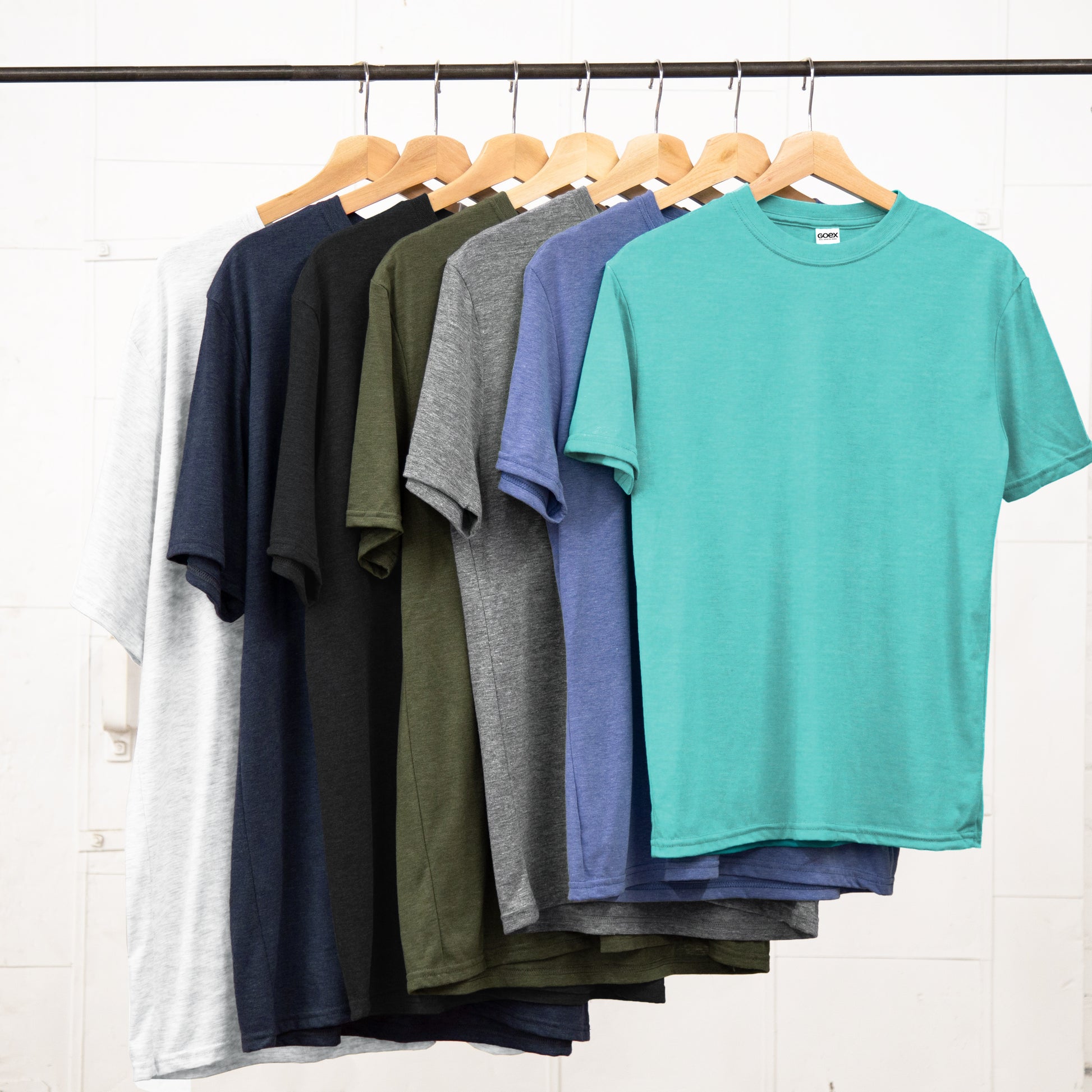 Unisex Size Run hanging on a garment rack