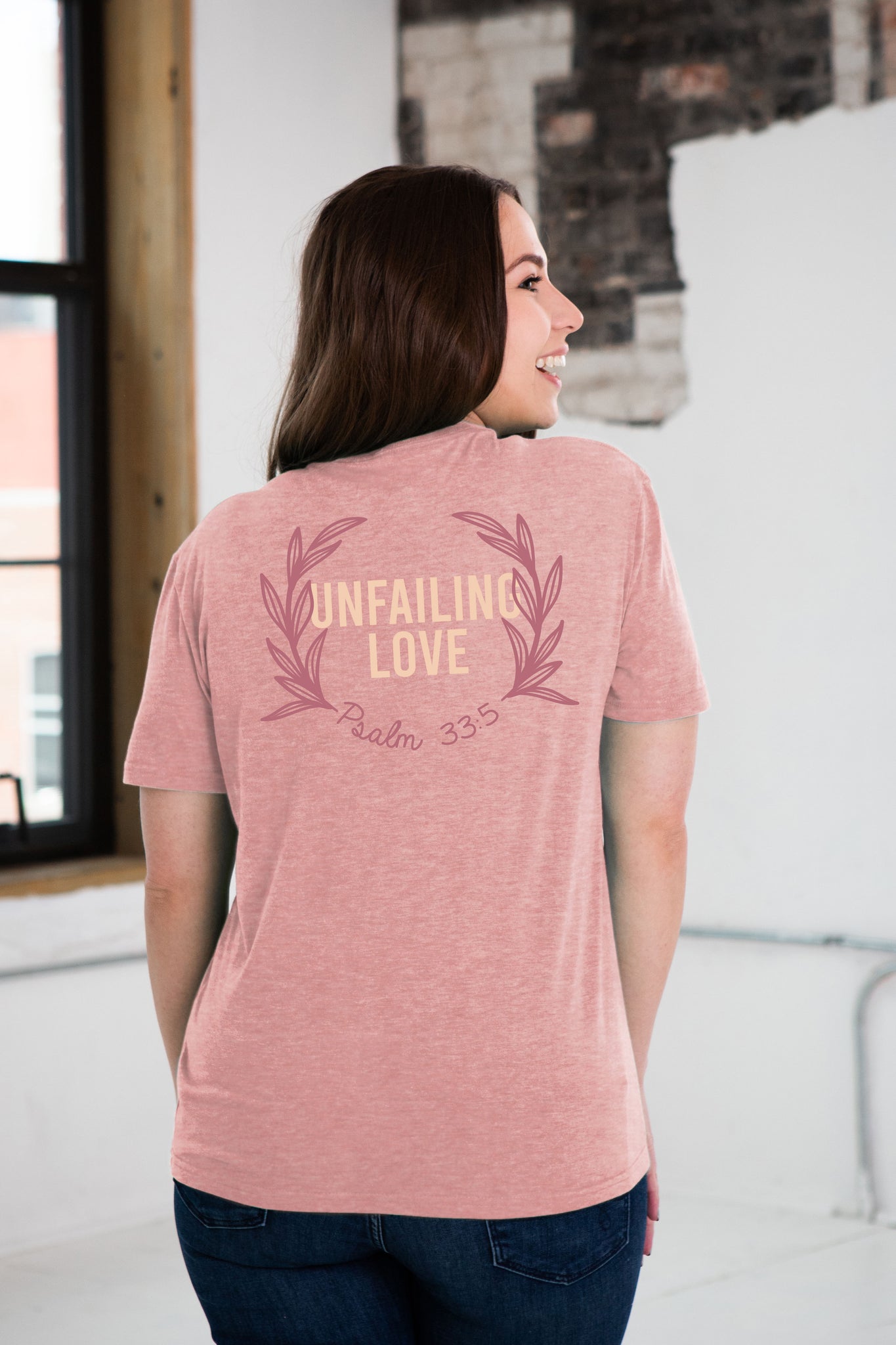 Back View of Female Model wearing Unfailing Love Graphic Tee in Rose