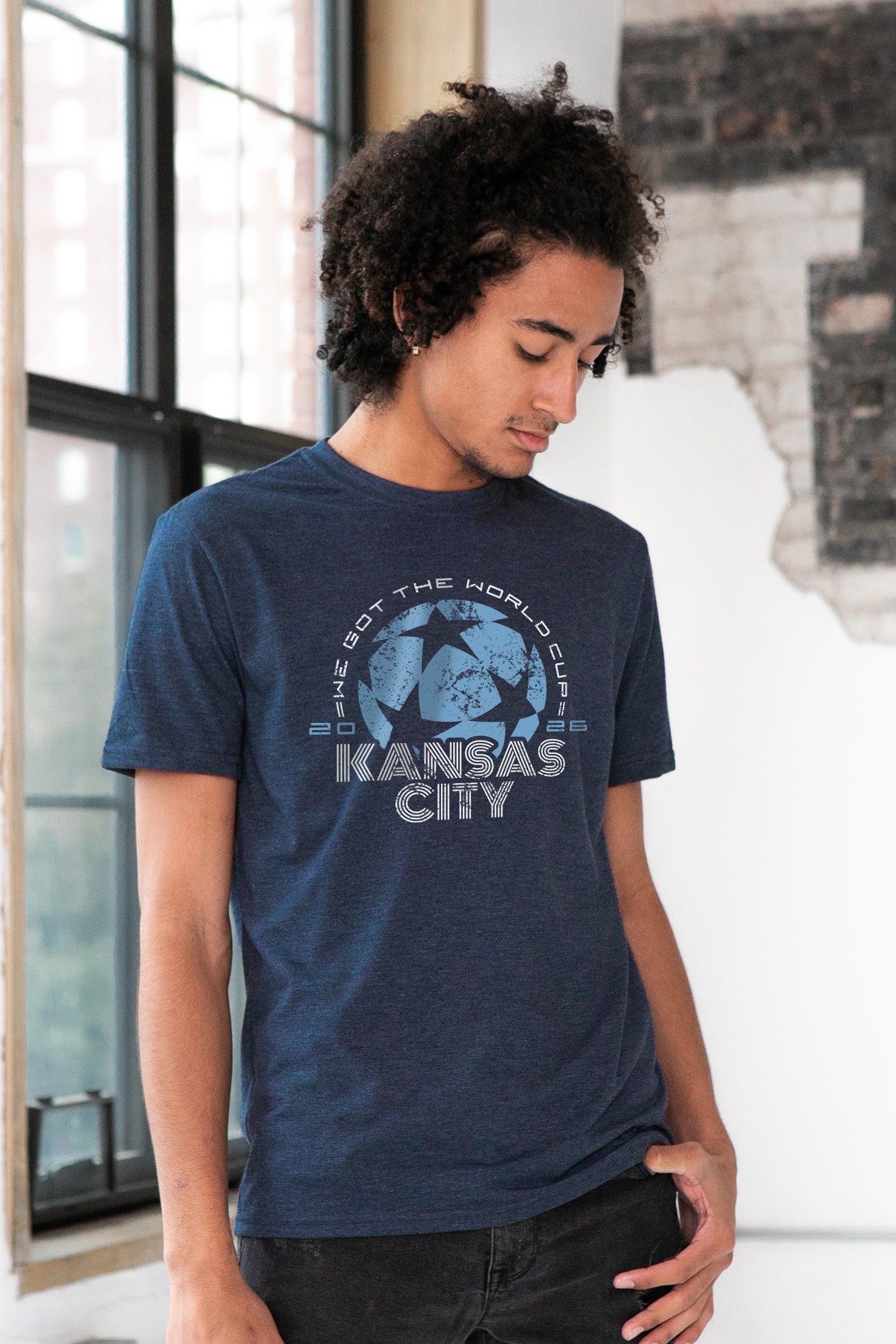 Male Model wearing GOEX Unisex and Men's World Cup Eco Triblend Graphic Tee in Navy
