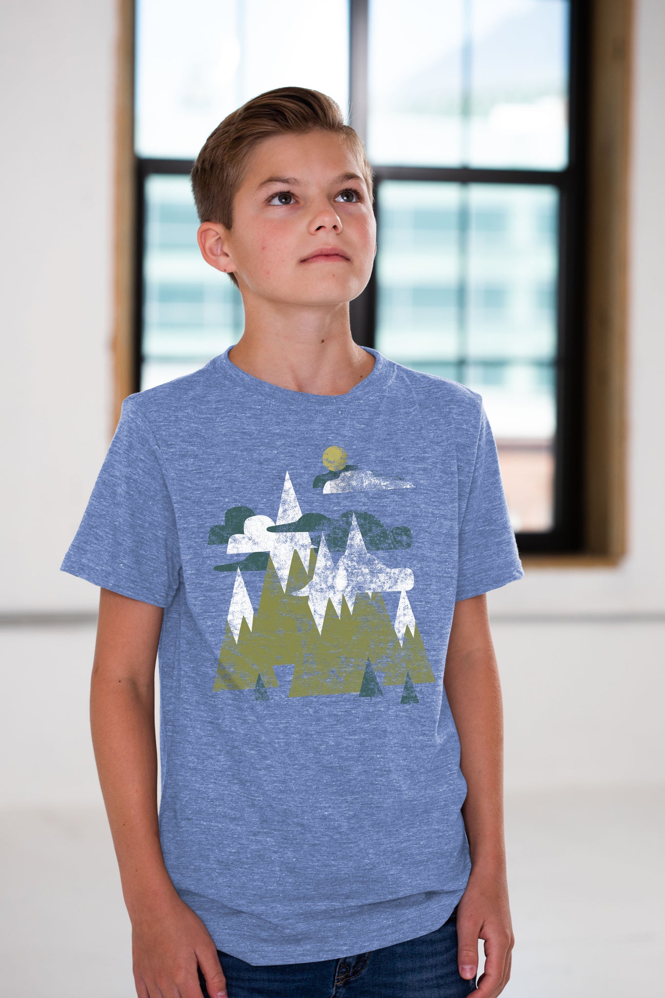 Boy Model wearing GOEX Youth Mountains Eco Triblend Graphic Tee in Light Blue